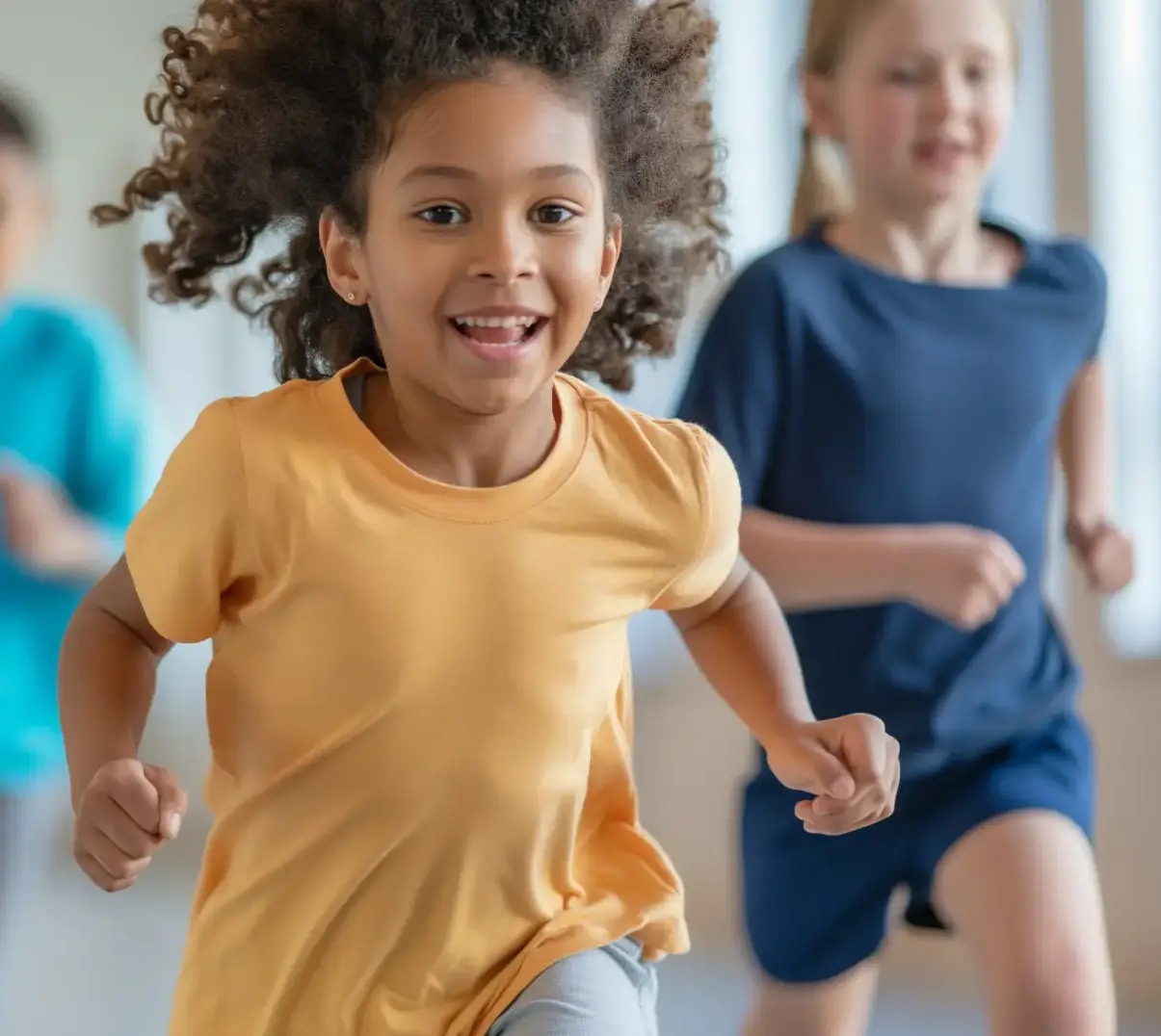 Children running and smiling in a school environment