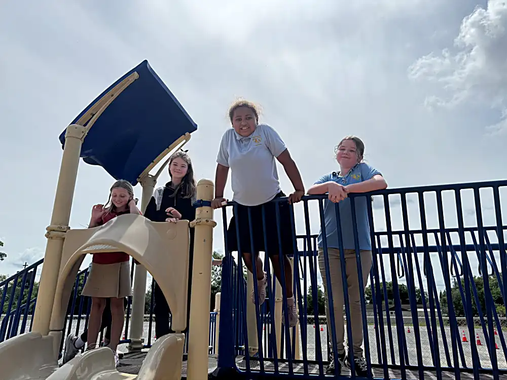 Hudson students on playground equipment